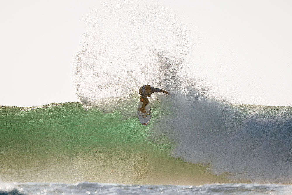 The sun is low but Gabriel Medina is high on wave.